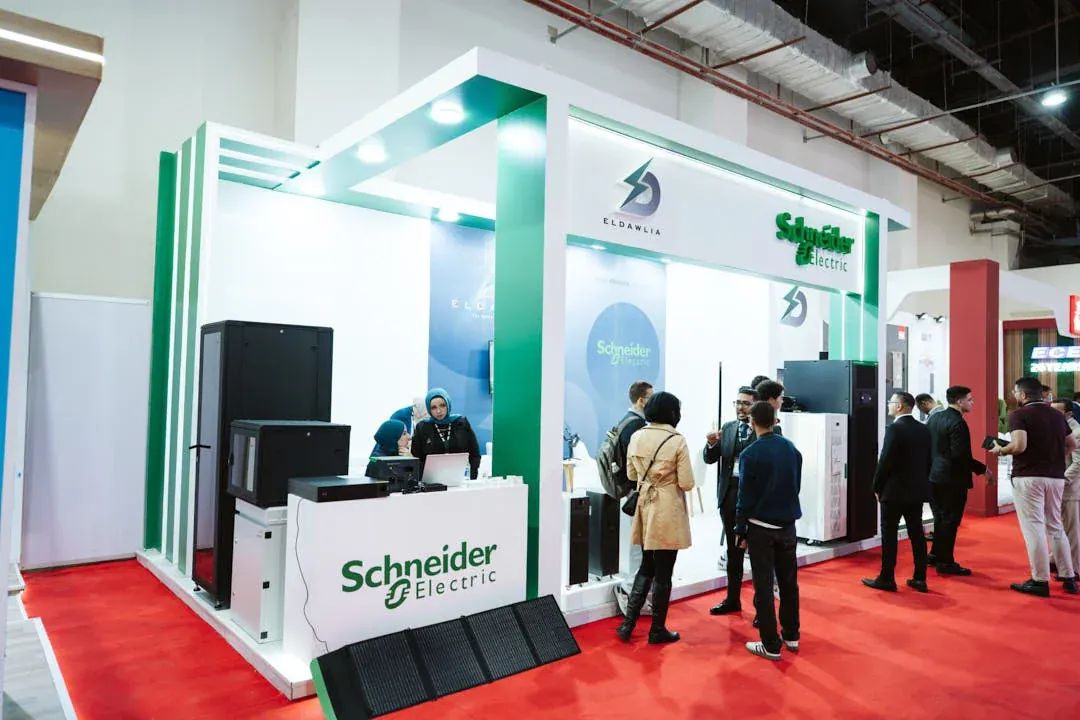 A vibrant El Dawlia booth capturing attention with dynamic visuals and bold branding.