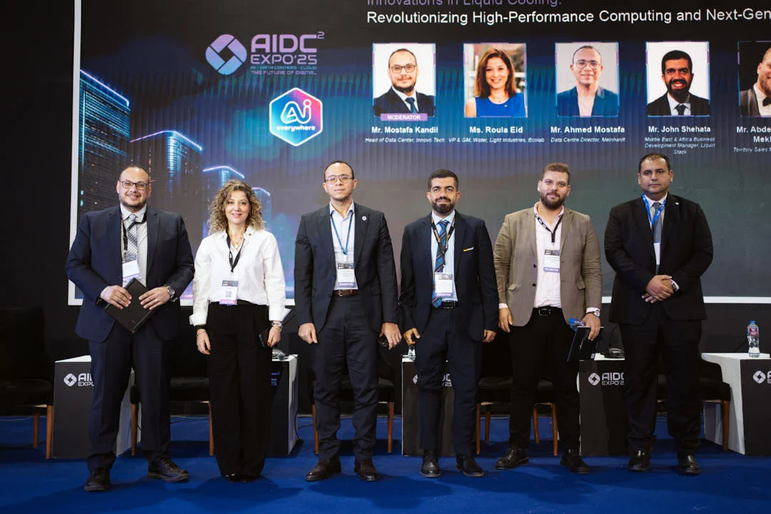 Panel speakers on stage at AIDC² Expo 2025