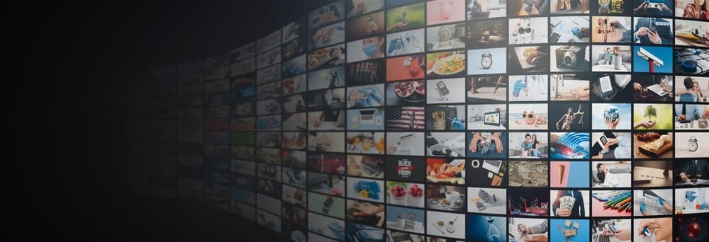 A wall of AIDC² Expo photographs
