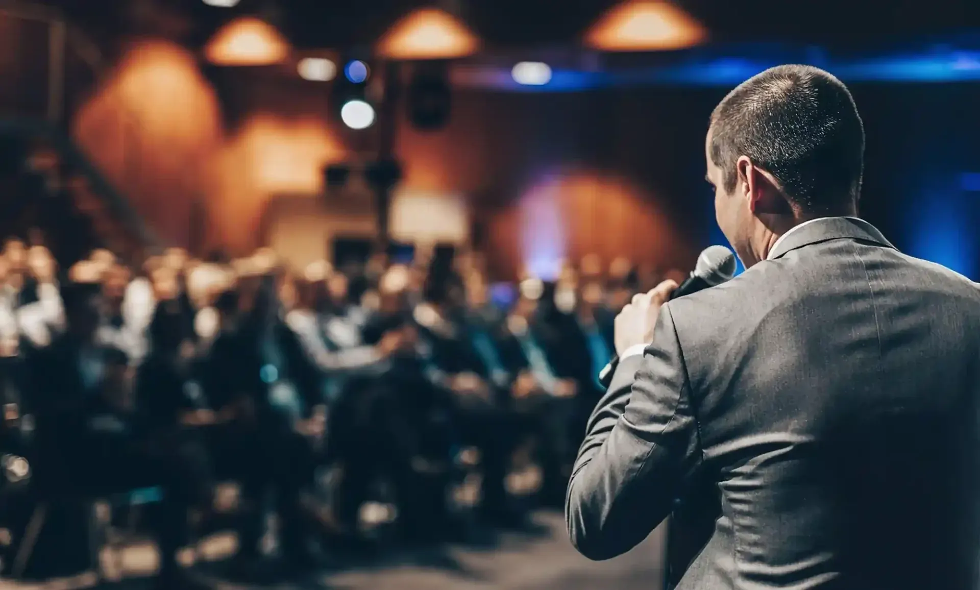 A speaker addressing the AIDC² Expo audience