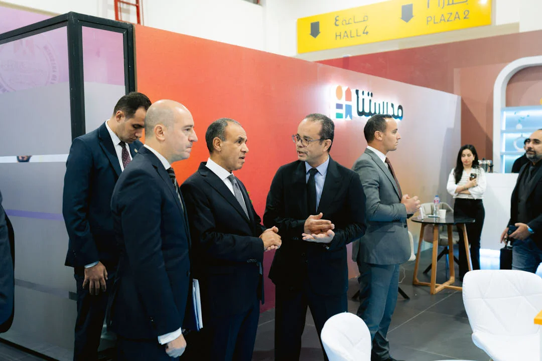 Guests at an exhibition stand in the AIDC² Expo 2025 hall