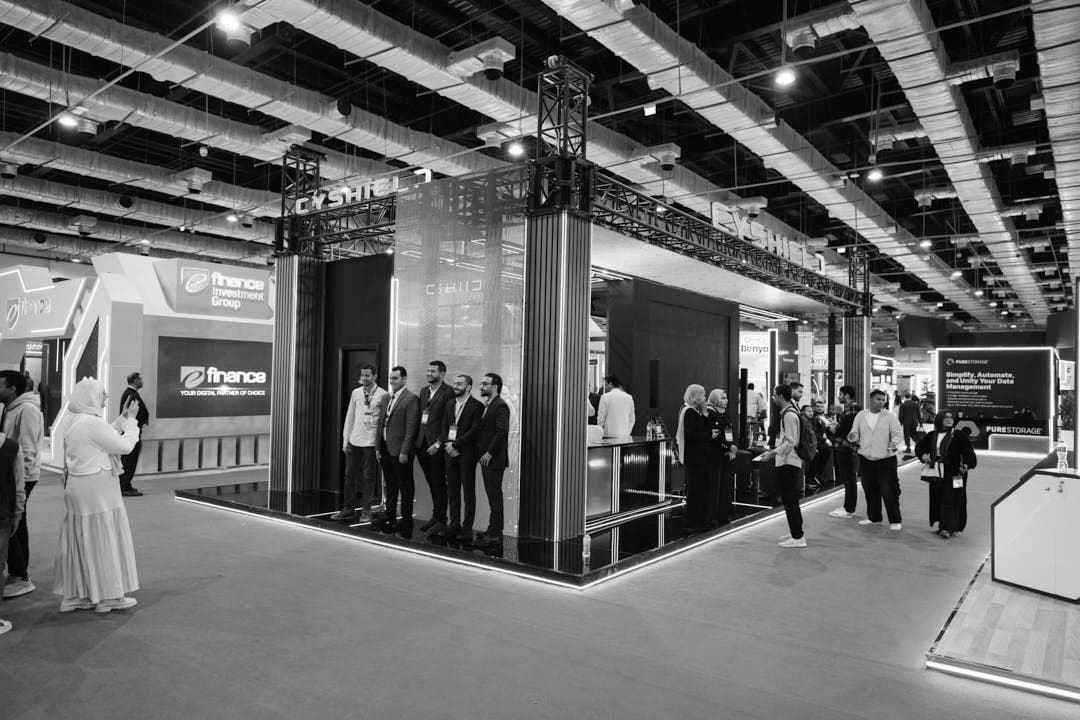 Visitors at an AIDC² Expo 2025 stand